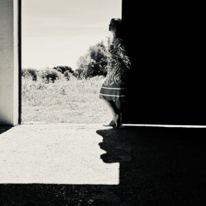 Artist Grażyna Ostrowska standing at the entrance of her Algarve studio